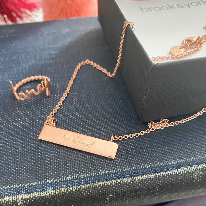 @peonyandhoney flay lay with Nella Rope Ring and Name Bar by @brookandyork