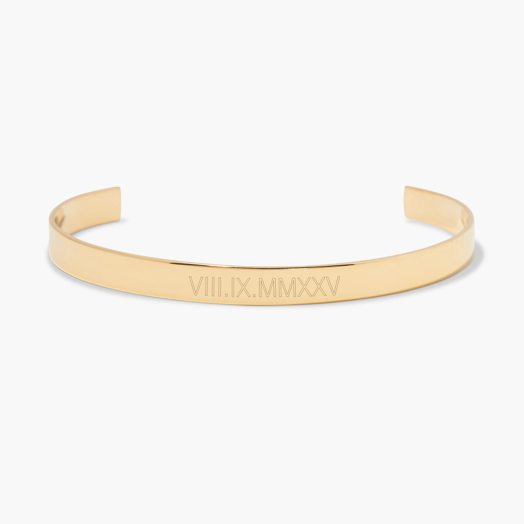 Roman Numeral Fine Cuff bracelet, a slim open-ended cuff engraved with a custom date in Roman numerals.