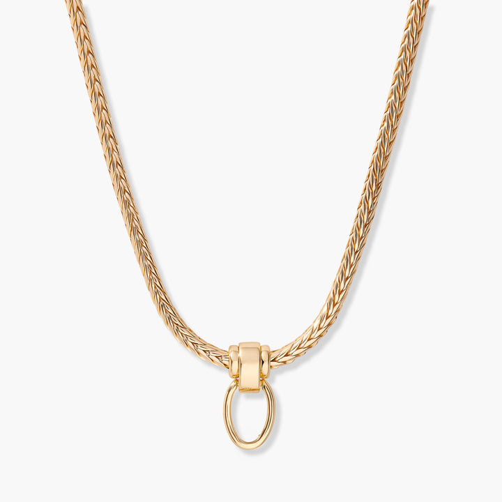Gold-tone Poppy Charm Necklace with a thick woven chain and a polished ring clasp at the center front.