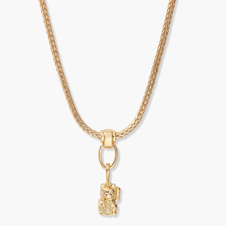 Lucky cat charm necklace with a braided chain and ring clasp, the three-dimensional maneki-neko pendant hanging from an oval link.