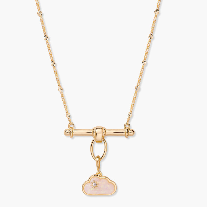 Charm necklace with a T-bar center and a pink opal cloud charm accented by a star-set crystal, on a chain with faceted disc stations.