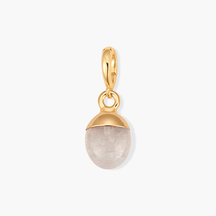 Perla Birthstone Charm with an oval pale pink stone set in a domed cap, suspended from a ring clasp.