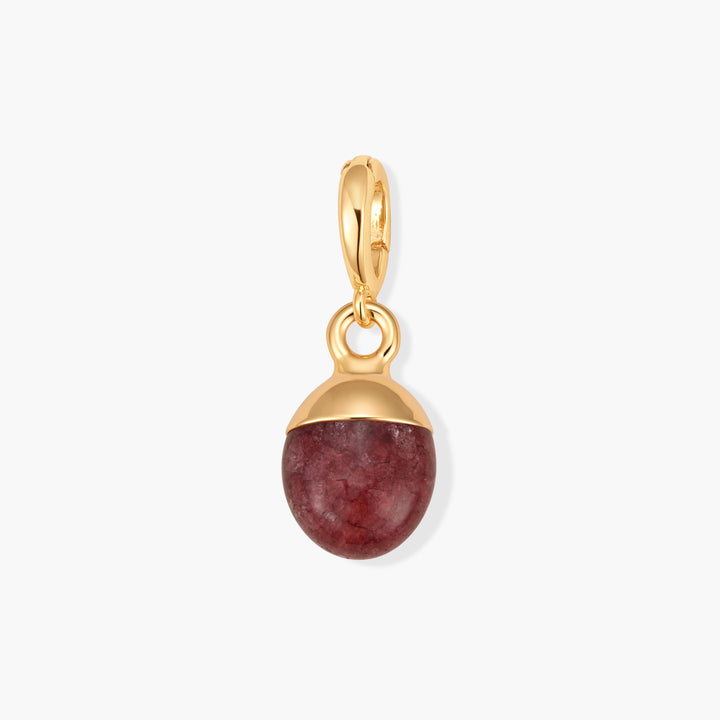 Perla Birthstone Charm with an oval ruby gemstone capped in a dome setting and a ring clasp.
