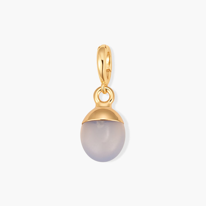 Perla Birthstone Charm with an oval blue chalcedony stone in a cap setting and ring clasp.