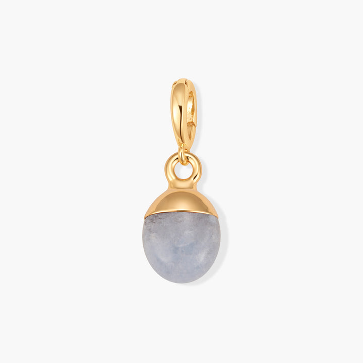 Perla Birthstone Charm with an oval blue aquamarine stone set in a domed cap and ring clasp.