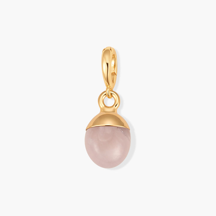Perla Birthstone Charm with a pale pink oval stone set in a cap and ring clasp.