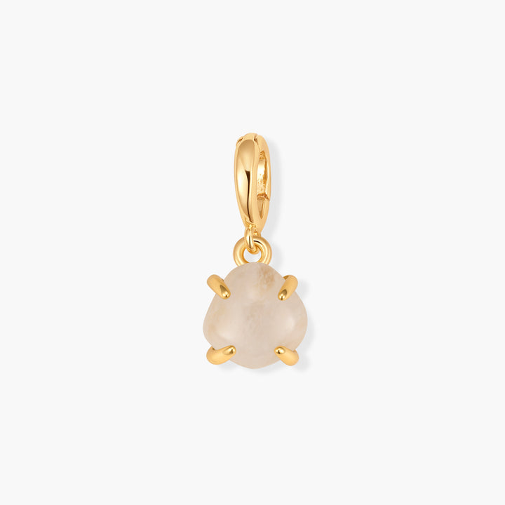 Mabel Birthstone Charm with a round pale moonstone cabochon in a prong setting, suspended from a ring clasp.