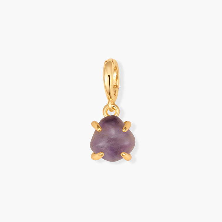 Mabel Birthstone Charm with a tumbled purple amethyst stone held by a prong setting and a ring clasp bail.