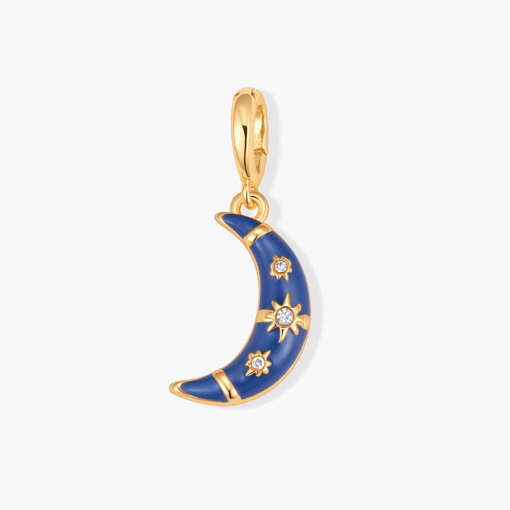 Gold-tone crescent moon charm with navy blue enamel, star-burst crystal accents, and a ring clasp.