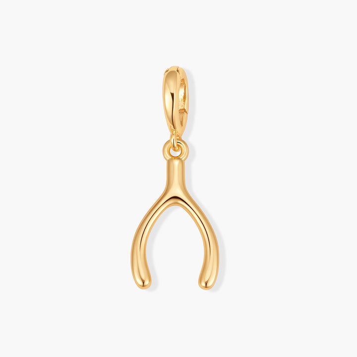 Gold-tone Poppy Wish Bone Charm with a polished, puffy wishbone pendant suspended from a ring clasp.