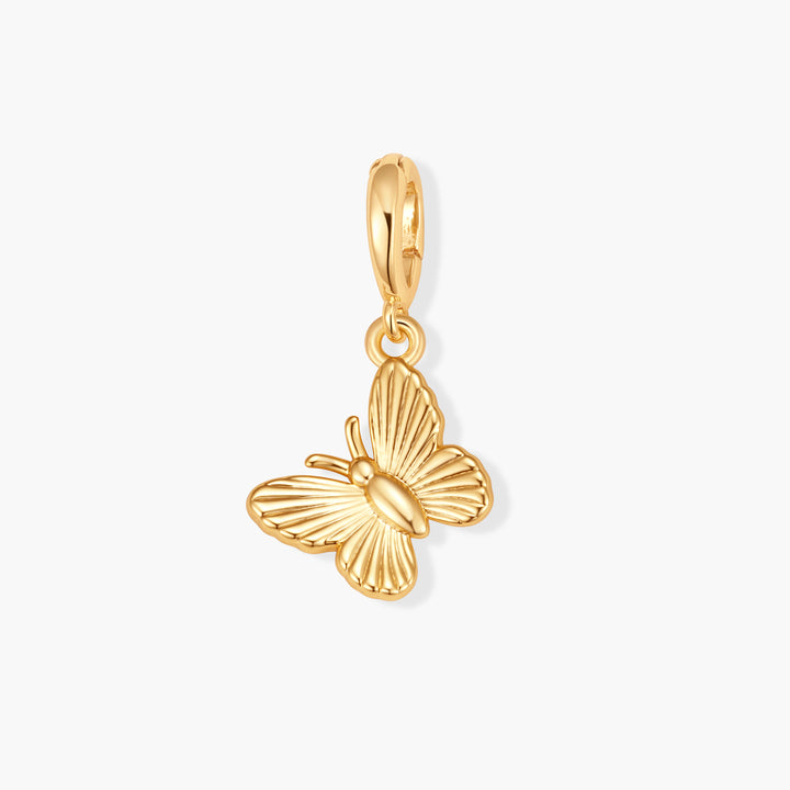 Gold-tone Poppy Butterfly Charm with ridged wing detail and a ring clasp.
