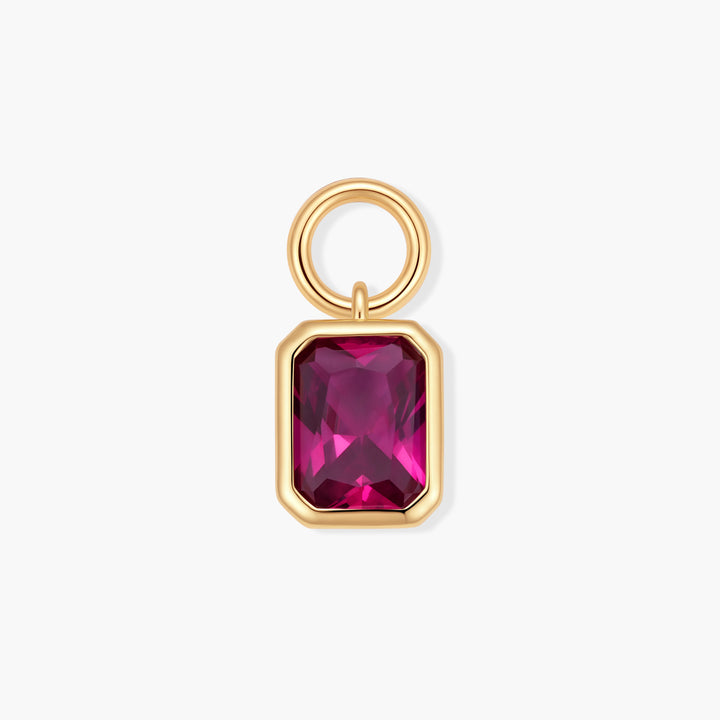 Birthstone charm with a bezel-set rectangular ruby-pink stone and a ring clasp, in a vibrant fuchsia colorway distinct from the main photo.