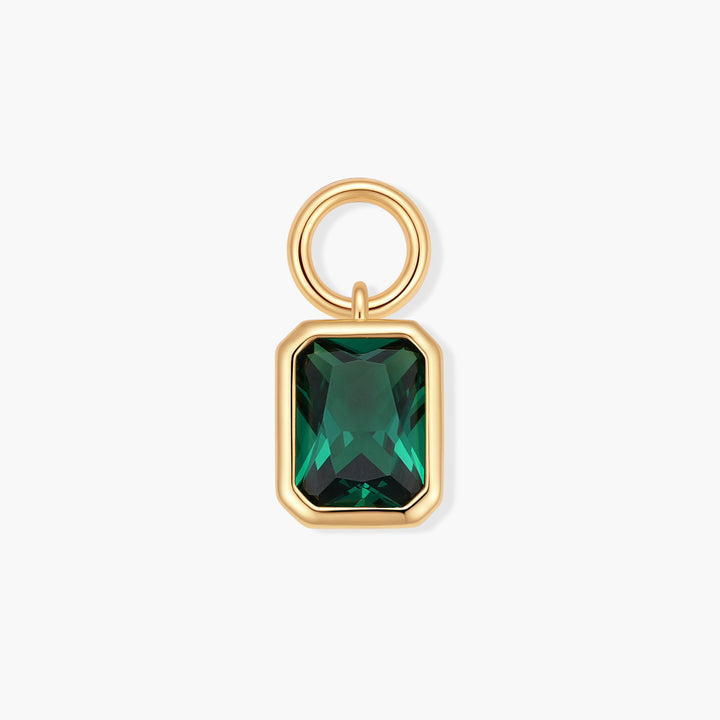 Birthstone charm with a bezel-set rectangular green stone and a ring clasp for attaching to jewelry.