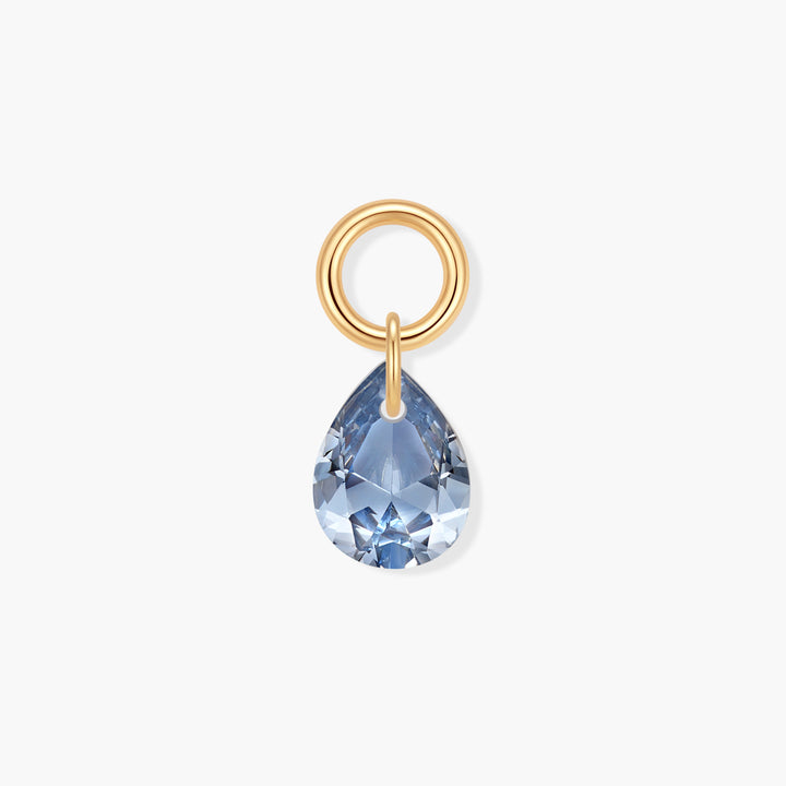 Vivienne Teardrop Birthstone Charm with a faceted blue pear-shaped crystal suspended from a ring clasp.