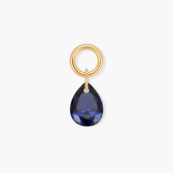 Vivienne Teardrop Birthstone Charm with a faceted blue pear-shaped stone suspended from a ring clasp.