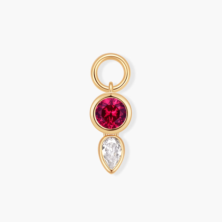 Vivienne Double Drop Birthstone Charm with a bezel-set round pink-red stone above a pear-shaped white stone and a ring clasp.