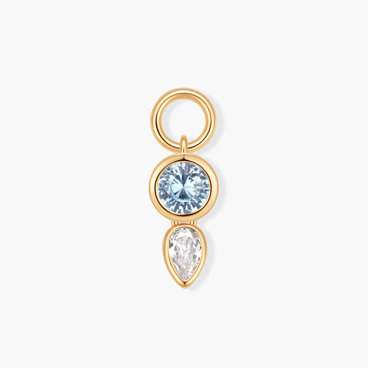Vivienne Double Drop Birthstone Charm with a bezel-set round blue stone above a pear-set clear stone, with a ring clasp.