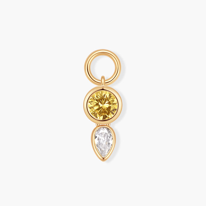 Vivienne Double Drop Birthstone Charm with a bezel-set round yellow stone above a pear-shaped white stone, attached to a ring clasp.