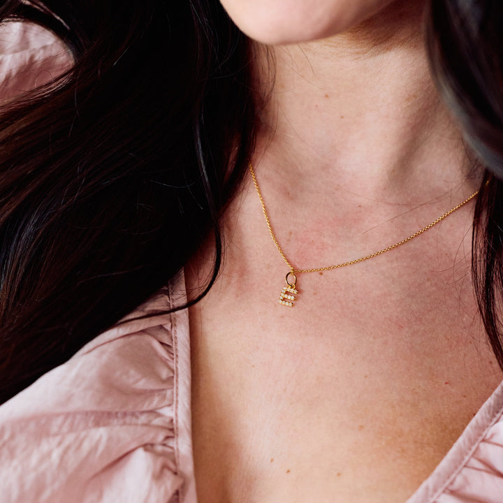 Blaire Diamond Initial Pendant necklace with a pavé-set letter charm, worn by a model.