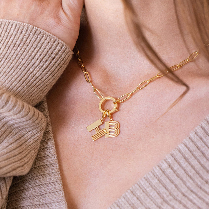 Gold necklace with a &