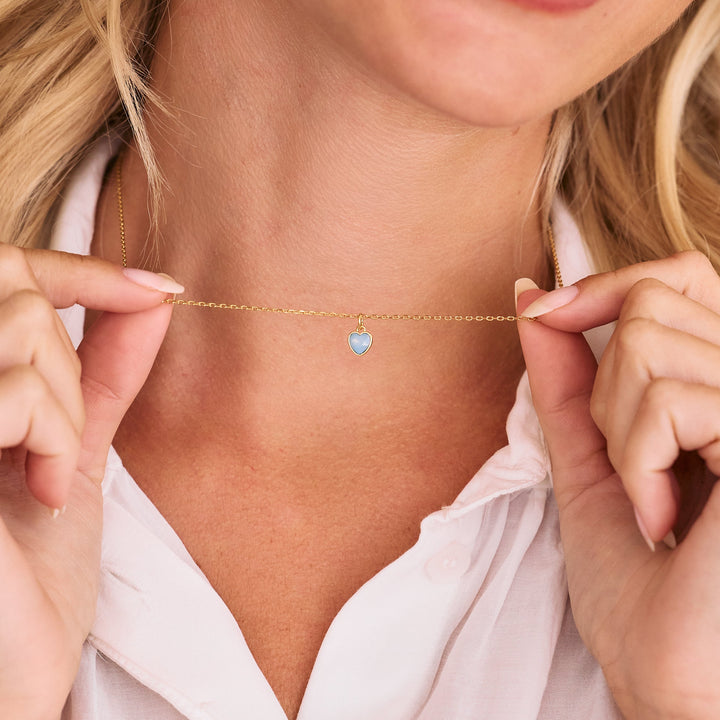 gold rolo chain on women&