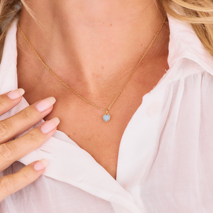gold rolo chain on women&
