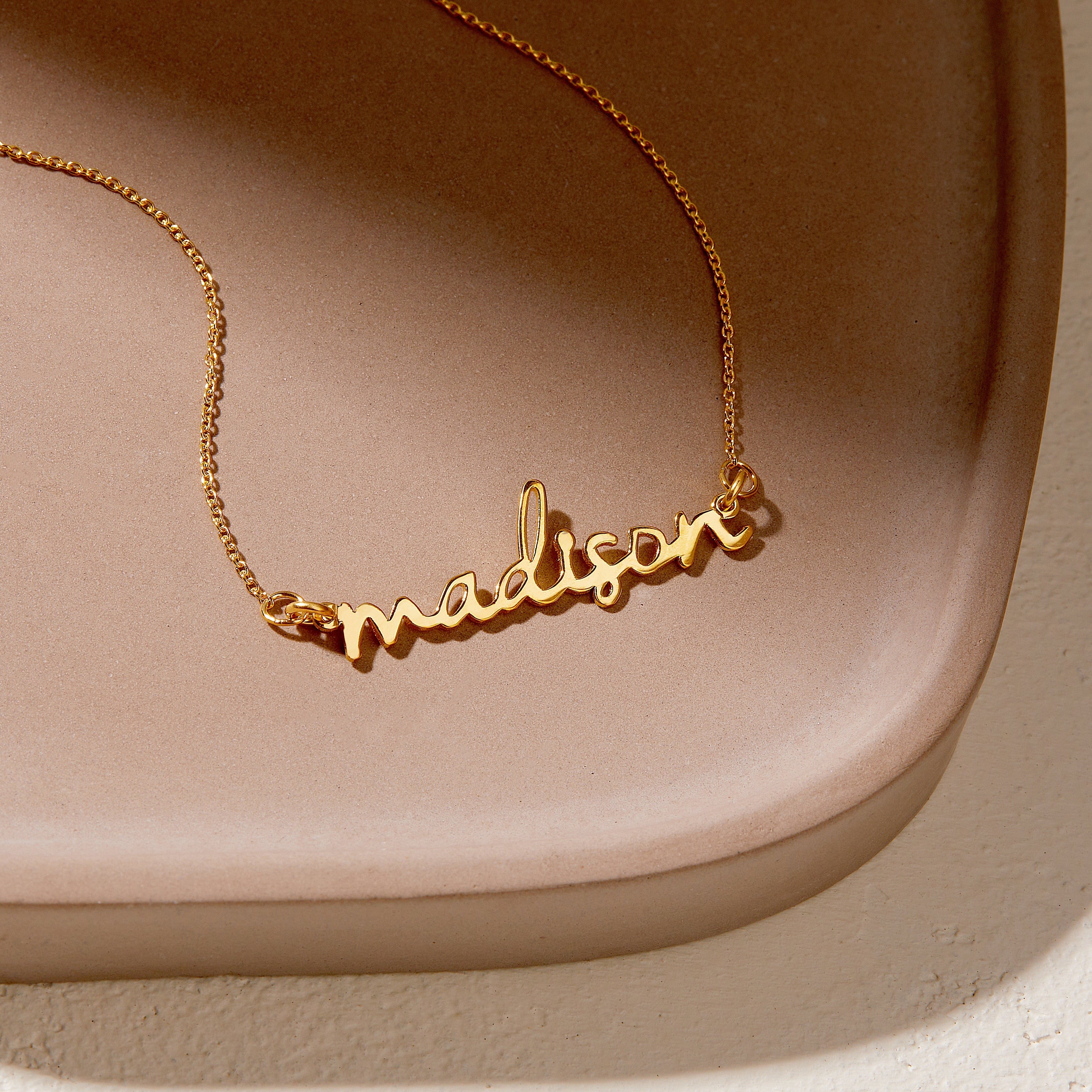 How The Nameplate Necklace Has Become A Symbol Of Empowerment